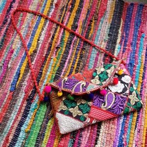 Multi colored pompom party purse